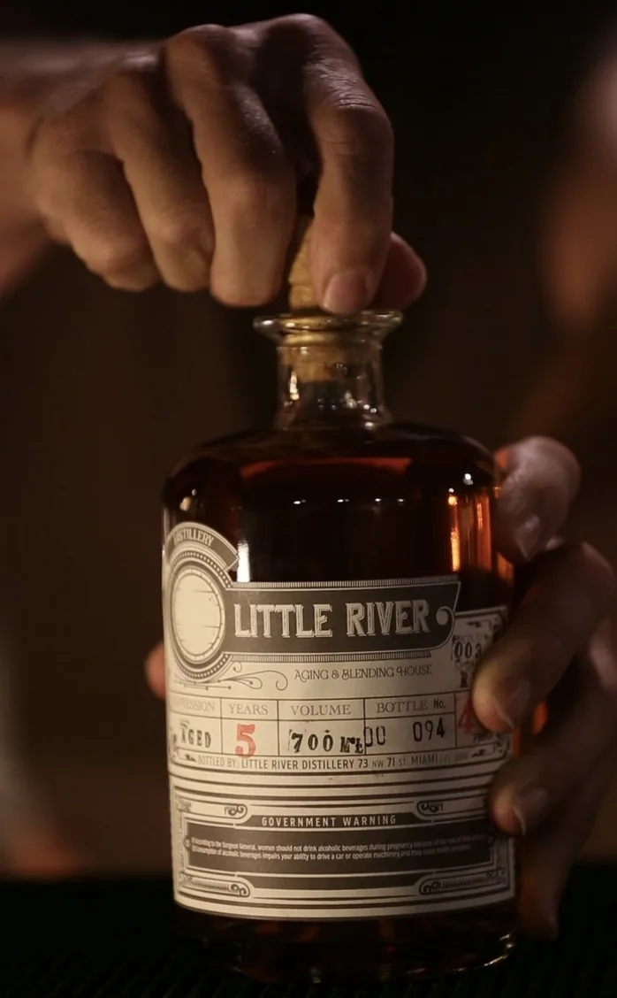 A bottle of Little River rum, aged 5 years, hand-labeled and bottled on site